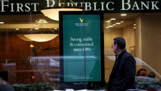 A person walks past a First Republic Bank branch in Midtown Manhattan in New York City, New York, U.S., March 13, 2023.