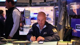 Traders work on the floor of the New York Stock Exchange during morning trading on April 10, 2023 in New York City. 