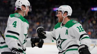 Dallas Stars' Joe Pavelski (16) is congratulated by Miro Heiskanen (4) after scoring during the first period of an NHL hockey game against the St. Louis Blues Wednesday, April 12, 2023, in St. Louis. (AP Photo/Jeff Roberson)