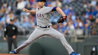 Texas Rangers starting pitcher Jacob deGrom throws to a Kansas City Royals batter during the first inning of a baseball game, Monday, April 17, 2023, in Kansas City, Mo. (AP Photo/Reed Hoffmann)