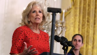 FILE - U.S. first lady Jill Biden speaks as Lieutenant Colonel Jasmine Moghbeli (R) listens during a reception celebrating Nowruz at the East Room of the White House on March 20, 2023 in Washington, DC.