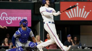 ARLINGTON, TEXAS – APRIL 11: Jonah Heim #28 of the Texas Rangers watches the flight of his three-run walk-off home run during the tenth inning against the Kansas City Royals at Globe Life Field on April 11, 2023 in Arlington, Texas. (Photo by Sam Hodde/Getty Images)
