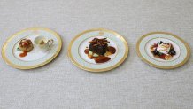 WASHINGTON, DC - APRIL 24: The first course of Maryland crab cake, main course of braised beef short ribs, and dessert of banana split are displayed at a media preview of the state dinner during Wednesday's visit by South Korean President Yoon Suk Yeol and his wife Kim Keon Hee in the State Dining Room at the White House on April 24, 2023 in Washington, DC. President Joe Biden will also hold a bilateral meeting and joint news conference with President Yoon during the state visit on Wednesday. (Photo by Alex Wong/Getty Images)