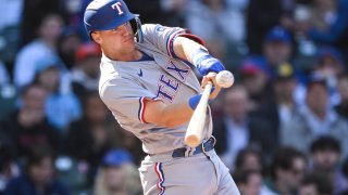 CHICAGO, ILLINOIS – APRIL 08: Josh Jung #6 of the Texas Rangers hits an RBI single in the third inning at Wrigley Field on April 08, 2023 in Chicago, Illinois. (Photo by Quinn Harris/Getty Images)