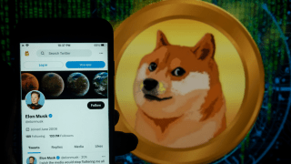 In this photo illustration, the Elon Musk’s twitter account seen displayed on a mobile phone screen with a Dogecoin logo in the background. (Photo Illustration by Idrees Abbas/SOPA Images/LightRocket via Getty Images)