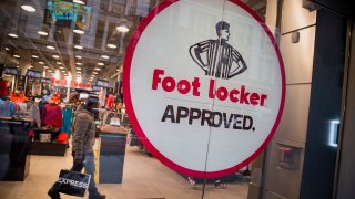 Foot Locker Inc. signage is displayed in the window of a store in New York, U.S.
