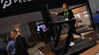 Maggie Lu uses a Peloton Tread+ treadmill during CES 2018 at the Las Vegas Convention Center, January 11, 2018.