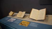 A magazine-sized version of the U.S. Constitution is displayed center.