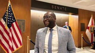 Democratic Florida Sen. Shevrin Jones is pictured outside the Senate chambers in Tallahassee, Fla., Wednesday, April 26, 2023. Jones and other LGBTQ+ lawmakers around the country feel like they are fighting for their existence in conservative states where anti-LGBTQ+ legislation is moving forward. (AP Photo/Brendan Farrington)