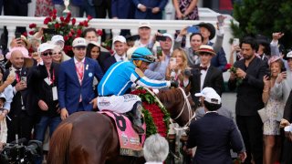 Javier Castellano, atop Mage, reacts in the winner’s circle after winning the 149th running of the Kentucky Derby horse race at Churchill Downs Saturday, May 6, 2023, in Louisville, Ky.