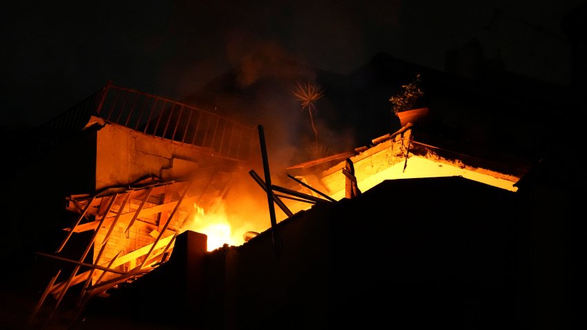 Fire burns at an apartment of an Islamic Jihad commander for northern Gaza, following Israeli airstrikes in Gaza City, early Tuesday, May 9, 2023. Israeli aircraft conducted strikes on Islamic Jihad targets in the Gaza Strip, the Israeli military said. The Palestinian Health Ministry said a number of people were killed and injured in the airstrikes.