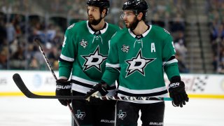 FILE - In this Friday, Dec. 29, 2017 file photo, Dallas Stars left wing Jamie Benn (14) and center Tyler Seguin (91) look over the St. Louis Blues defense during the first period of an NHL hockey game in Dallas.Jamie Benn and Tyler Seguin were regularly among the NHL's top scorers when they first started playing together in Dallas a decade ago. Now 30-something forwards, Benn the captain and six-time All-Star Seguin are far removed from skating together on the top line, or even leading their own team in scoring while having the two biggest contracts on the Stars roster.