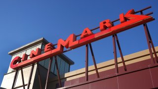 MELROSE PARK, ILLINOIS – DECEMBER 04: The Cinemark logo hangs above one of the company’s theaters shuttered by the coronavirus COVID-19 on December 04, 2020 in Melrose Park, Illinois. In what could be another blow to the theater industry, Warner Bros. Pictures on Thursday announced that all of its 2021 films will stream on HBO Max during the same time the films will be playing in theaters.