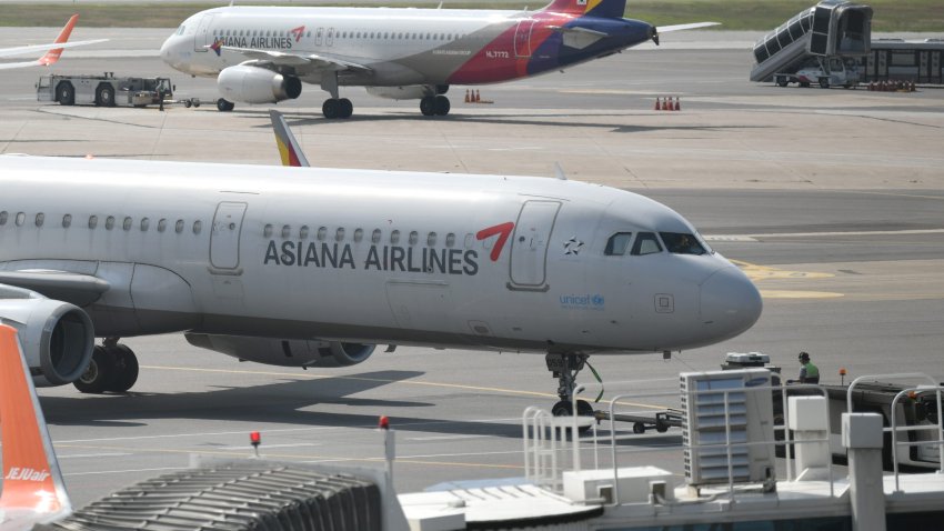 This picture taken on September 8, 2020 shows an aircraft of Asiana Airlines on the tarmac at Gimpo airport in Seoul. – A 2-billion-USD-plus deal for a South Korean property developer to take over loss-making Asiana Airlines collapsed on September 11 in the wake of the COVID-19 coronavirus pandemic, with state-owned banks mounting a bail-out to try to save 9,000 jobs. (Photo by Jung Yeon-je / AFP) (Photo by JUNG YEON-JE/AFP via Getty Images)