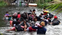 Migrants travel through the waters of the Rio Grande to the U.S., as seen from Matamoros, Mexico, May 11, 2023.