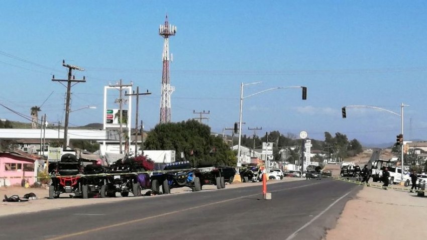 Members of the army and police secure the perimeter at the site of a long-gun attack on a group of amateur rally drivers in Ensenada, Mexico, on May 20, 2023. At least 10 people were killed and nine wounded on Saturday when gunmen attacked a group of amateur rally drivers in the northern Mexican town of Ensenada, near the US border, authorities said.