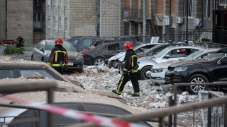 Firefighters inspect site of damaged residential building aftermath of nighttime drone attack in Kyiv, Ukraine amid Russia-Ukraine war on May 30, 2023.