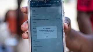 REYNOSA, MEX- FEB 23: A screen shot shows a system error in the CBP One app at a shelter for migrants on Thursday, Feb. 23, 2023 in Reynosa, Mexico. Migrants have been waiting in Mexico due to the continuation of Title 42 expulsions. An app was created for migrants to be able to set appointments to apply for asylum but it has been riddled with error messages and a lack of cohesive instructions leaving many unable to navigate it and properly set up appointments. (Sergio Flores for The Washington Post via Getty Images)