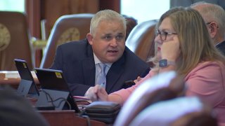 Bryan Slaton, center, was expelled from the Texas House on May 9, 2023.