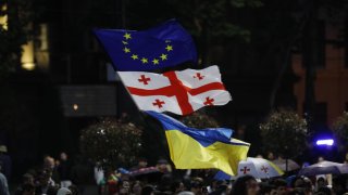 People gathered in the streets of Tbilisi in May to protest after a Russian passenger plane landed in the Georgian capital, completing the first direct flight from Moscow after a four-year hiatus, on May 20, 2023.