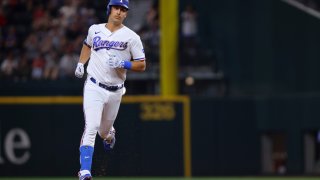 Texas Rangers' Nathaniel Lowe rounds the bases after hitting a two-run home run in the third inning of a baseball game against the Los Angeles Angels, Tuesday, June 13, 2023, in Arlington, Texas. Corey Seager also scored on the shot.