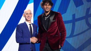 Dereck Lively II poses for a photo with NBA Commissioner Adam Silver after being selected 12th overall by the Oklahoma City Thunder during the NBA basketball draft, Thursday, June 22, 2023, in New York.