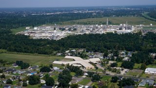 The Fifth Ward Elementary School and residential neighborhoods sit near the Denka Performance Elastomer Plant, back, in Reserve, La., Sept. 23, 2022.