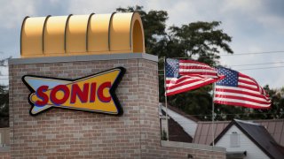A sign hangs on the side of a Sonic restaurant on September 25, 2018 in Cicero, Illinois.