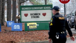 File - Officers on site as students begin to arrive for their first day back at Richneck Elementary School in Newport News, Va., on Jan. 30, 2023.