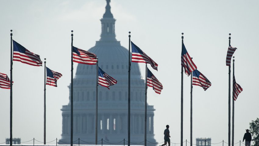 American flags at the Washington Monument near the US Capitol in Washington, DC.