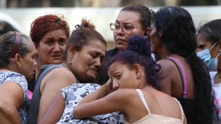 TEGUCIGALPA, HONDURAS – JUNE 20: Relatives hug each other as they await the bodies of loved ones who were killed at a women’s prison in Honduras, on June 20, 2023. At least 41 inmates were killed on Tuesday at a women’s prison northwest of Honduras’ capital Tegucigalpa, said the Honduran Public Prosecutor’s Office. (Photo by Emilio Flores/Anadolu Agency via Getty Images)