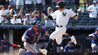 NEW YORK, NEW YORK – JUNE 25: Harrison Bader #22 of the New York Yankees scores a run off a single by Giancarlo Stanton #27 in the eighth inning against the Texas Rangers during their game at Yankee Stadium on June 25, 2023 in Bronx borough of New York City.