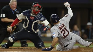 ARLINGTON, TEXAS – JUNE 30: Yainer Diaz #21 of the Houston Astros scores a run as Jonah Heim #28 of the Texas Rangers cannot make the tag in time in the sixth inning at Globe Life Field on June 30, 2023 in Arlington, Texas.