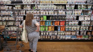 A person shops in a supermarket in New York City on June 10, 2022.