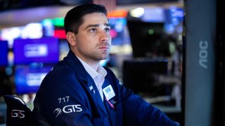 Traders work on the floor of the New York Stock Exchange.
