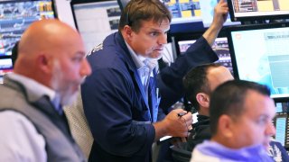 Traders work on the floor of the New York Stock Exchange during afternoon trading on July 18, 2023 in New York City.