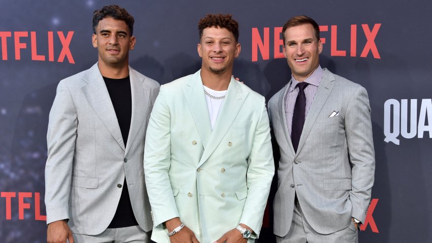 US american football players Marcus Mariota (L), Patrick Mahomes (C) and Kirk Cousins arrive for the premiere of Netflix’s docuseries “Quarterback” at the Tudum Theatre in Los Angeles, on July 11, 2023.