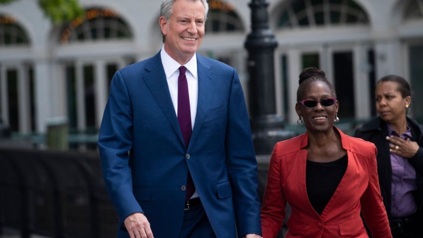 Former New York City Mayor Bill de Blasio, with his wife Chirlane McCray, in 2019.  (Photo by JOHANNES EISELE/AFP via Getty Images)