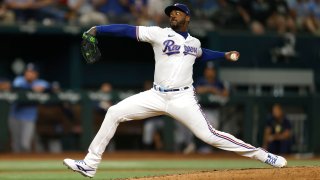 Aroldis Chapman #45 of the Texas Rangers pitches against the Tampa Bay Rays during the ninth inning at Globe Life Field on July 17, 2023 in Arlington, Texas. The Rangers won 3-2.
