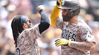 SAN DIEGO, CA – JULY 30: Gary Sanchez #99 of the San Diego Padres, is congratulated by Fernando Tatis Jr. #23 of the San Diego Padres after he hit a solo home run during the fifth inning of a baseball game against the Texas Rangers on July 30, 2023 at Petco Park in San Diego, California.
