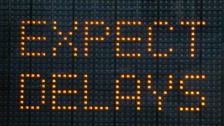 Urban traffic congestion sign saying Expect Delays