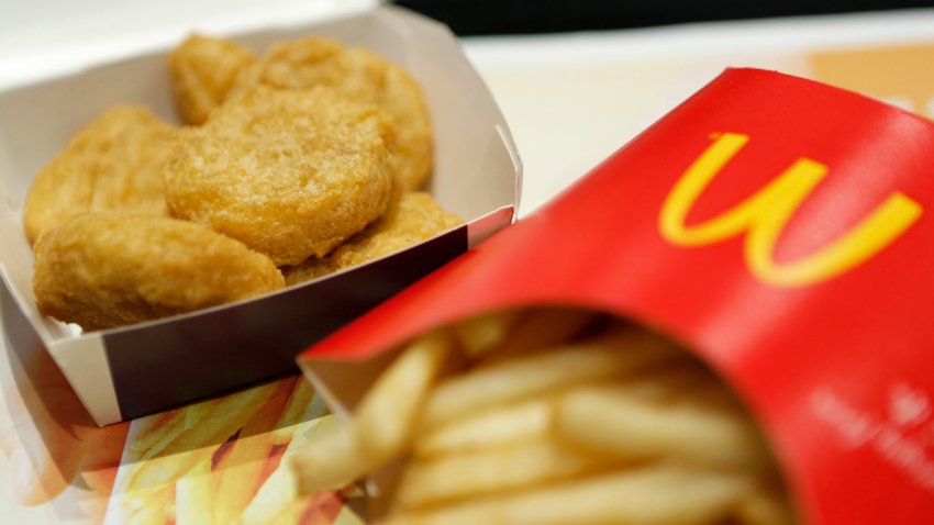 A box of chicken nuggets, left, sits beside a portion of french fries in this arranged photograph at a McDonald’s restaurant, operated by McDonald’s Holdings Co. Japan Ltd., in Tokyo, Japan, on Wednesday, Jan.7, 2015. McDonald’s Corp.’s Japan business and Cargill Inc. are investigating complaints objects were found in chicken nuggets made by a Cargill factory in Thailand, the restaurant chainâs second food safety crisis in six months.  Photographer: Kiyoshi Ota/Bloomberg via Getty Images