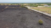 A grassfire charred 180 acres in northern Tarrant County Wednesday, July 19, 2023.
