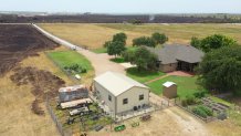 A grassfire charred 180 acres in northern Tarrant County Wednesday, July 19, 2023, getting close to Wesley Cleveland's home. 