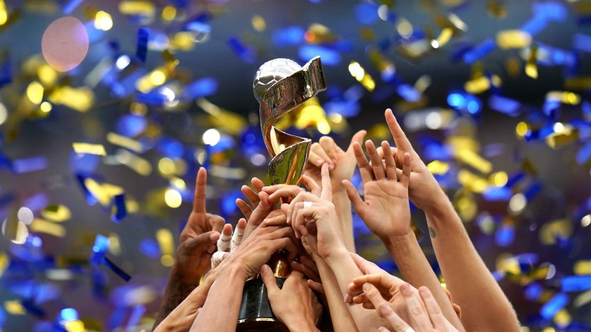 The USWNT celebrates winning the FIFA Women’s World Cup trophy after the final whistle.