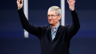 Apple CEO Tim Cook gestures on stage during an Apple special event in San Francisco, California