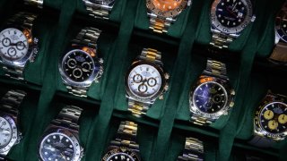 A tray of Rolex watches are seen on a dealer’s stand at the London Watch Show on March 19, 2022 in London, England.