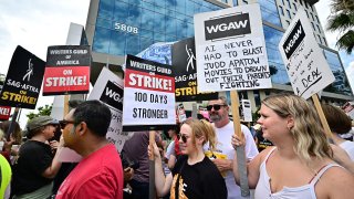 Members of the Writers Guild of America (WGA) and the Screen Actors Guild walk the picket line outside of Netflix in Hollywood, California, on August 9, 2023.