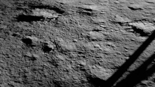 The shadow of the Chandrayaan-3 spacecraft is seen on the moon’s surface.
