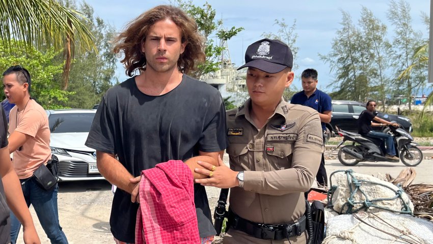 A Thai police officer escorts Spanish Daniel Sancho Bronchalo on suspicion of murdering and dismembering a Colombian surgeon from Koh Phagnan island to Koh Samui Island court, southern Thailand, Monday, Aug. 7, 2023. Sancho, the son of two Spanish film stars, has been arrested in Thailand on suspicion of murdering and dismembering Edwin Arrieta Arteaga on a tourist island, police said. Sancho was taken from Koh Phagnan, where the remains of the Colombian surgeon were found, to another island, Samui, where he is being held, Surat Thani provincial police commander Saranyu Chamnanrat said Tuesday.